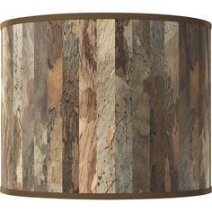 a lamp shade made out of wood planks on a white background with brown trim