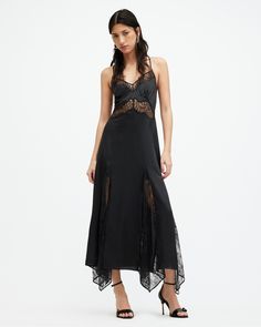 Let lace do the talking. The Jasmine Dress is expertly crafted from a conscious silk blend fabric to a slim fitting silhouette. The slip dress design is maxi-length with a v-neck and adjustable straps - at the back they cross over. Volume is created in the skirt with delicate lace additions and fuller shaping. With this dress, it's all in the detail.  This dress is designed to a slim fit Tie closure V-neck Sleeveless Maxi length Lace trim neckline and under bust Adjustable crossover straps Fulle Goth Wedding Guest Outfit, Goth Wedding Guest, Spanish Lace, Jasmine Dress, Maxi Slip Dress, Lace Inset, Lace Maxi, Going Out Outfits, Dress Robes