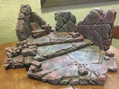 some rocks sitting on top of a wooden table