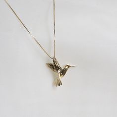 "Humming Bird Pendent Necklace . . . * Pendants Measurements With Bail: (16 x18 mm) * Gold KT: 14K Gold * Gold Color: Yellow Gold * Chain: Optional * Chain: 1 Box Chain * Stamp: 14k * Never gold filled or plated * 1-Day Shipping * Packaged With Free Gift Box . . . If you have any questions, just hit the \"Message the Seller\" button ( bottom right of the page) and we will get back to you within a few hours. . . . Check our Social Media @Talajewel, and let's be friends!  . . . Made in USA, Humming Bird Pendent Necklace, 14k Solid Yellow Gold Dainty Bird Necklace, Tiny Bird Necklace, Solid 14k Gold Charm, Gold Bird Necklace, Gift for babies, 14K Bird Charm Pendant, 14k solid gold Bird necklace, yellow gold necklace, thin chain, Dainty good luck necklace, Great for Layers. A Perfect 14K Gold Humming Bird Necklace, Gold Bird Necklace, Pendents Gold, Hummingbird Jewelry, Scorpio Necklace, Dainty Pendant Necklace, Hummingbird Necklace, Astrology Jewelry, Good Luck Necklace