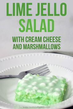 lime jello salad with cream cheese and marshmallows on a white plate