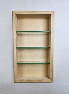 a wooden shelf with glass shelves on it