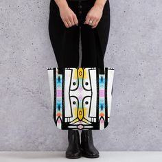 Small abstract Tote bag,  bright colourful canvas bag, long handled bag, nice casual tote bag The bag in the image is a vibrant and stylish tote featuring a modern, abstract design. The design consists of bold, black-and-white geometric shapes, accented with pops of bright colors like yellow, blue, and pink. The pattern appears symmetrical, creating an artistic and eye-catching look. The bag's red strap contrasts beautifully with the colorful pattern, adding a bold touch to the overall bag. ### Artistic Canvas Shoulder Bag With Large Capacity, Modern Multicolor Large Capacity Bag, Modern Large Capacity Multicolor Bag, Artsy Tote Bags For Shopping, White Geometric Bag For Everyday Use, Artistic Canvas Shoulder Bag As Gift, Artsy Shopping Tote Bag, White Geometric Everyday Bag, Artistic Rectangular Canvas Shopping Bag