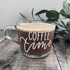 there is a cup of coffee with the words coffee game on it and leaves in the background