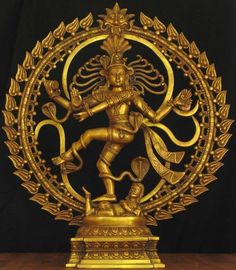 a golden statue is displayed in front of a black background