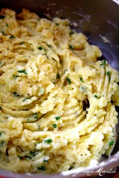 mashed potatoes with parsley in a metal bowl