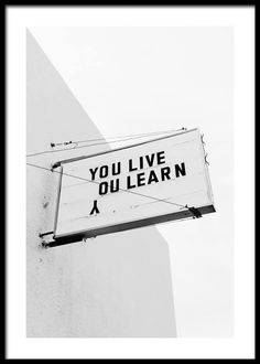 a sign on the side of a building that says you live oulearn,