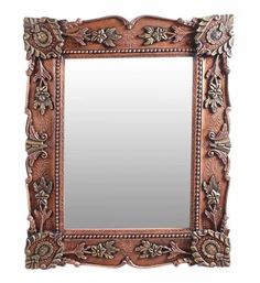 an ornate wooden frame mirror on a white background