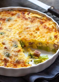 a casserole dish with broccoli and cheese