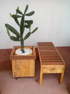 two small wooden planters sitting next to each other