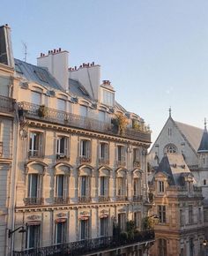 the building has many windows and balconies on it's roof terraces