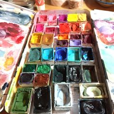 an artist's palette with many different colors of paint