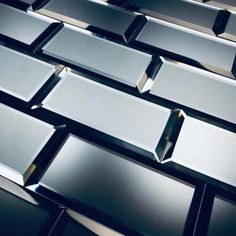 many shiny metal squares are arranged together