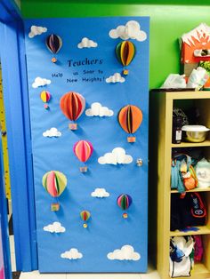 a classroom door decorated with hot air balloons