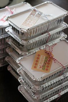 christmas cookie tins are stacked on top of each other and tied with twine