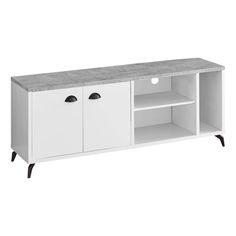 a white tv stand with two doors and drawers on one side, an open shelf underneath the cabinet