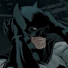 batman in the dark knight returns with his hands on his head and eyes wide open