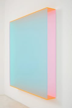 an abstract painting on the wall with blue and pink colors in it's center