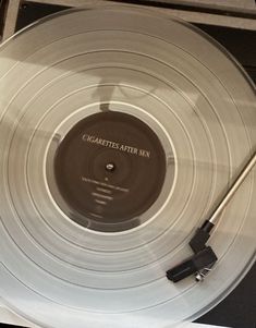 a record player's turntable sitting on top of a table