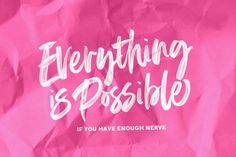 pink crumpled paper with the words everything is possible written on it in white ink against a magenta background