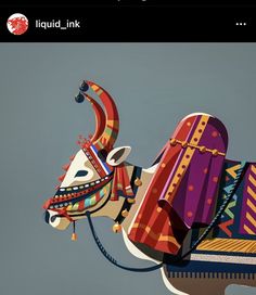 a colorfully decorated cow kite flying in the sky