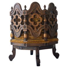 an old wooden chair with ornate carvings on it