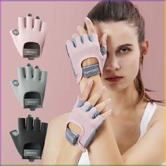 the woman is holding up her pink and gray gloves with two fingers on each hand