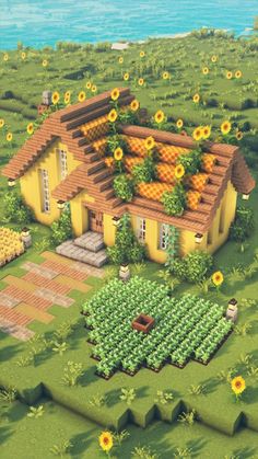 an aerial view of a yellow house surrounded by sunflowers