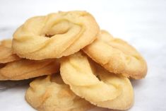 a pile of cookies sitting on top of a white countertop next to each other