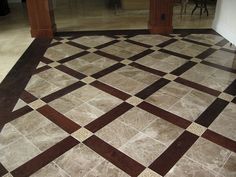 a tile floor with brown and white squares on it