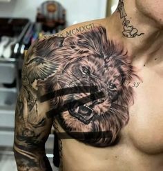 a man with a lion tattoo on his chest