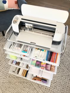 a sewing machine sitting on top of a table filled with lots of crafting supplies