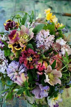 a bouquet of flowers sitting on top of a wooden table