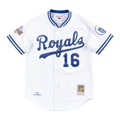 a baseball jersey with the name royals on it and two patches on the chest,