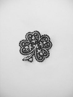 a black and white photo of a four leaf clover