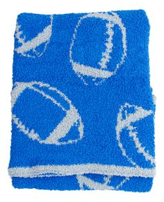 a blue rug with footballs and balls on it