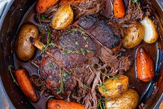 a pot roast with carrots, potatoes and beef