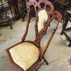 an old chair is sitting on the floor