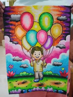 a person holding up a painting with balloons on it