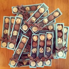 a table topped with blue boxes filled with chocolates