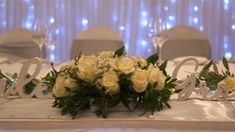 the table is set with white flowers and silverware for an elegant wedding breakfasteon