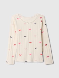 Soft cotton pointelle T-Shirt Round neck with bow applique.  Long sleeves.  Straight, easy fit.  Hits at the hip.  Sizes range from baby to toddler. Bow Applique, Trip Outfits, Baby Gap, Christmas Wishlist, Toddler Gifts, Shirts For Girls, Baby Toddler, Gap