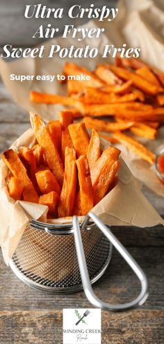 baked sweet potato fries in a colander with text overlay that reads, ultra crispy air fry sweet potato fries super easy to make