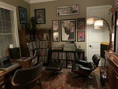 a living room filled with furniture and lots of records