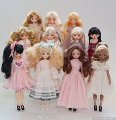 a group of dolls standing next to each other