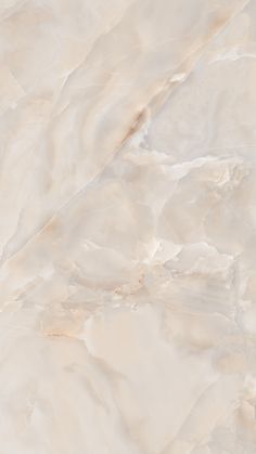 a white marble textured wall with light brown and beige colors on the top right hand corner