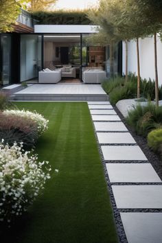 an outdoor area with grass, flowers and trees