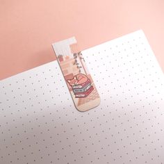 a pair of scissors sitting on top of a piece of paper with an image of a bus