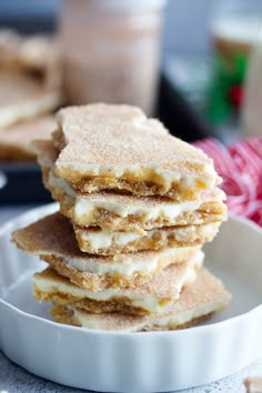 a stack of desserts sitting on top of a white plate