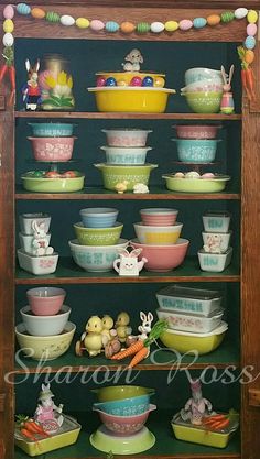 a shelf filled with lots of colorful dishes